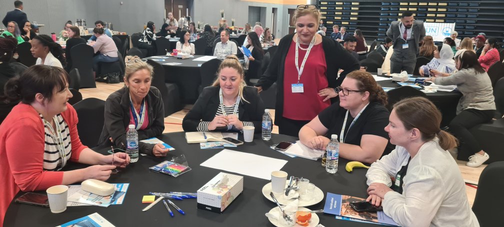 Educators and inclusion professionals collaborating during a hands-on Incluzun Summit workshop.